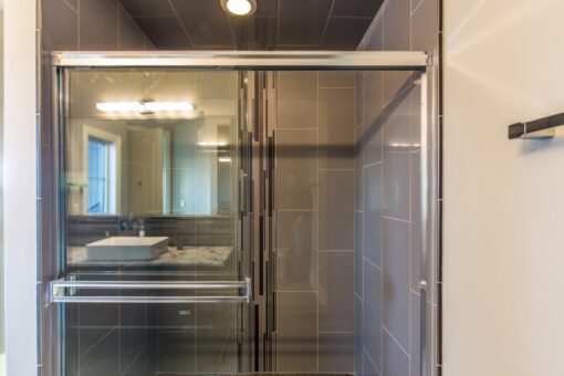 Presidio glass shower with dark tile