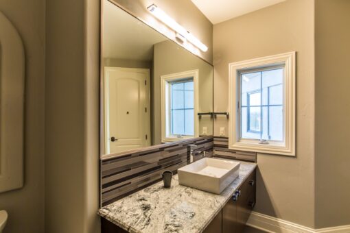 Presidio bathroom with vessel sink and granite counter