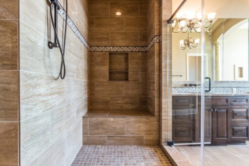 Presidio walk-in shower with stone tile and bench