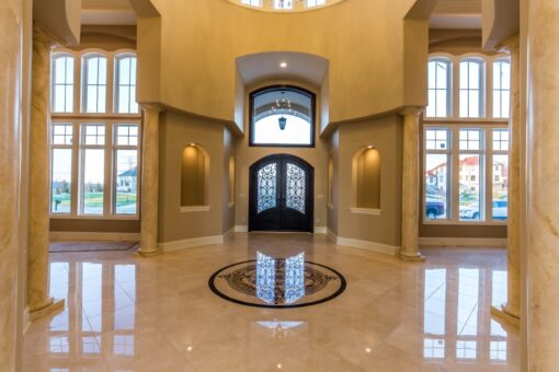 Presidio foyer with marble medallion and arched entry doors