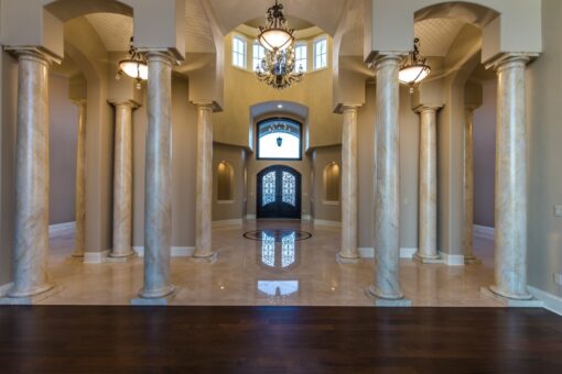 Presidio foyer with columns and arched entry doors