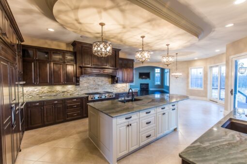 Presidio kitchen with white island and dark perimeter cabinetry