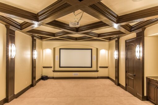 Presidio lower-level home theater with coffered ceiling
