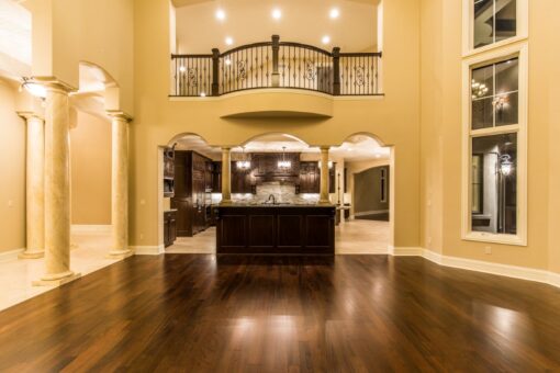 Presidio great room with balcony above and view to the kitchen