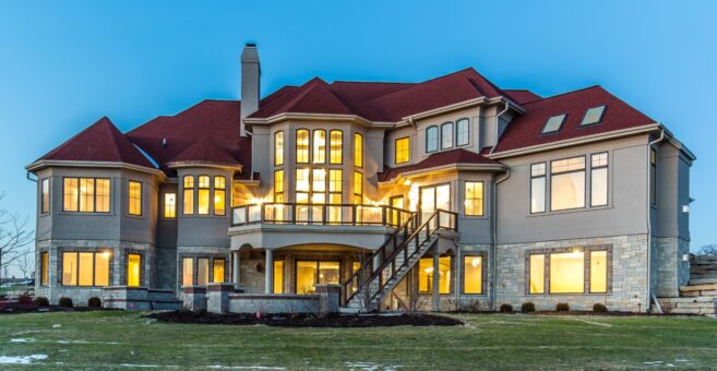 Presidio rear elevation lit at dusk with two-story deck