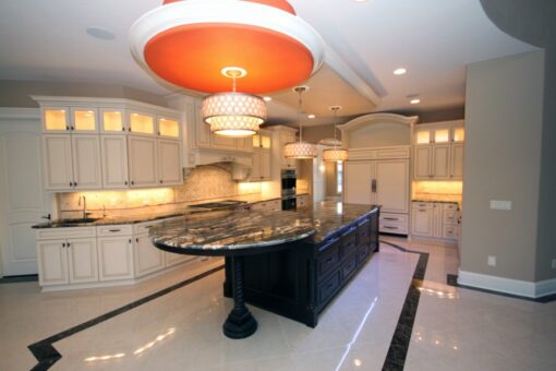 Haven kitchen with oval island and red pendant