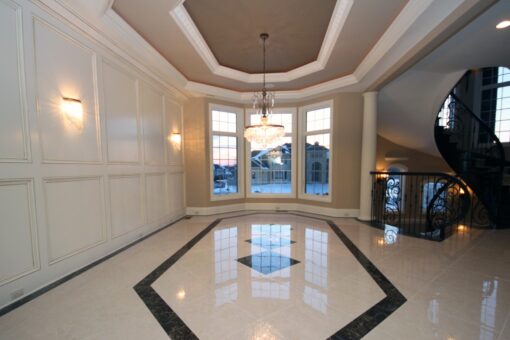 Haven dining room with tray ceiling and marble inlay floor