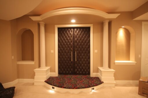 Haven arched double doors framed by columns