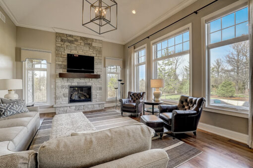 Wildwood hearth room with stone fireplace and beams