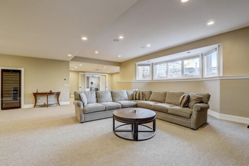Wildwood lower-level family room with sectional and walk-out windows