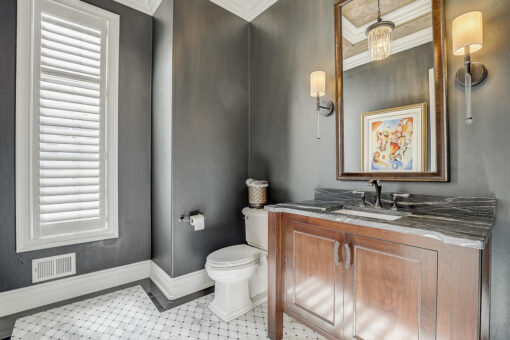 Wildwood powder room with gray walls and wood vanity