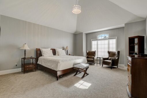 Wildwood bedroom with sitting area and vaulted ceiling