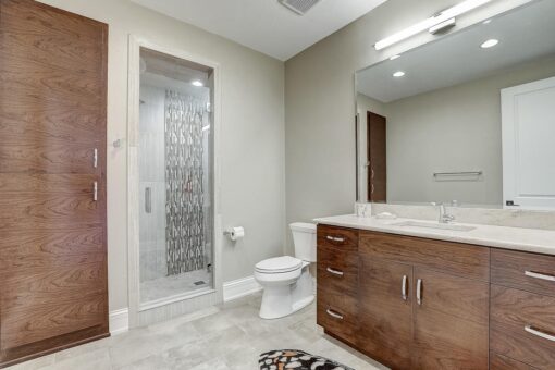 Wildwood bathroom with mosaic shower and wood vanity
