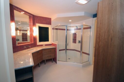 Haven bathroom with curved glass shower and vanity