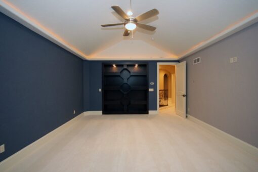 Haven bedroom with navy accent wall