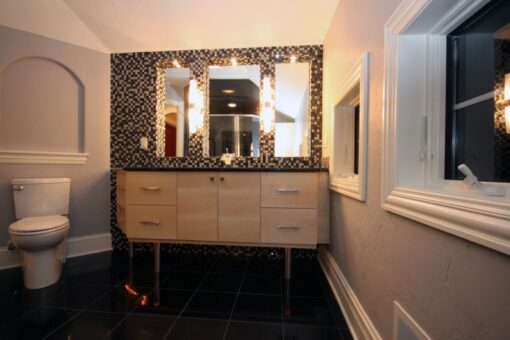 Haven powder room with mosaic tile and cream vanity