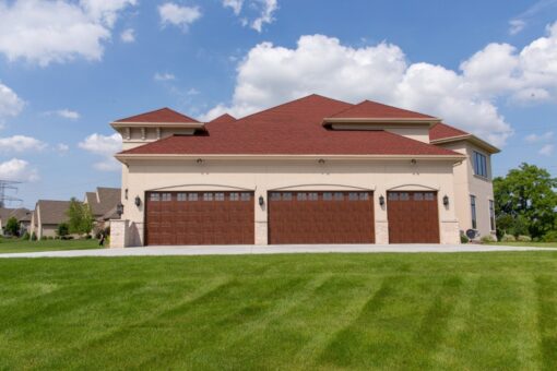 Callista three-car garage wing with red tile roof