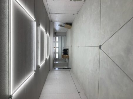 Woodland room with concrete floor and linear LED lighting