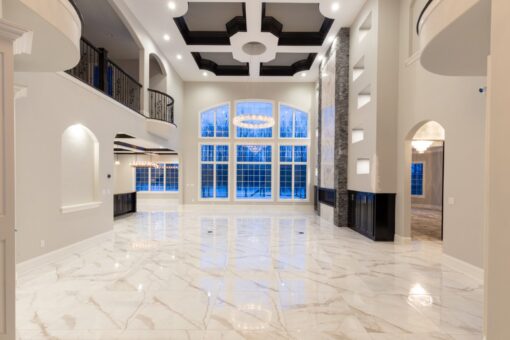 Woodland two-story foyer with coffered ceiling and window wall