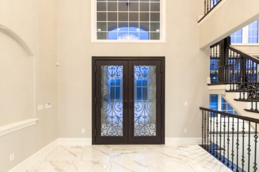Woodland arched iron and glass entry doors