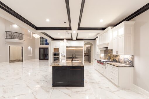 Woodland kitchen with coffered ceiling and white cabinetry