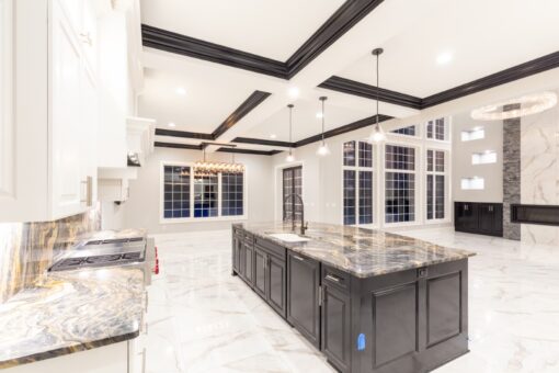 Woodland kitchen with dark island and window wall