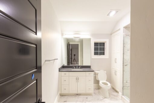Woodland bathroom with white vanity and window