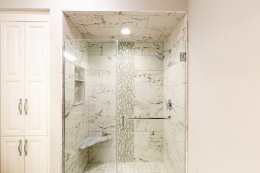 Woodland marble shower with mosaic stripe