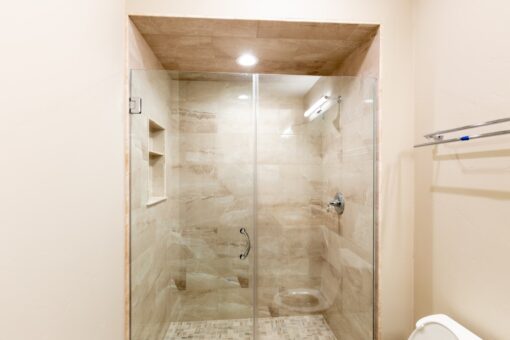 Woodland glass shower with marble tile