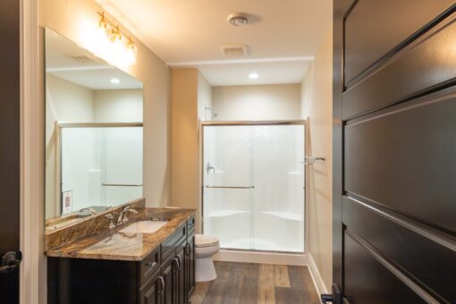 Woodland bathroom with wood vanity and glass shower