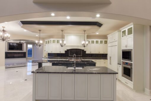 Callista kitchen island with black granite and stainless appliances
