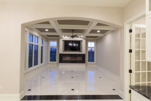 Callista hearth room with coffered ceiling and linear fireplace
