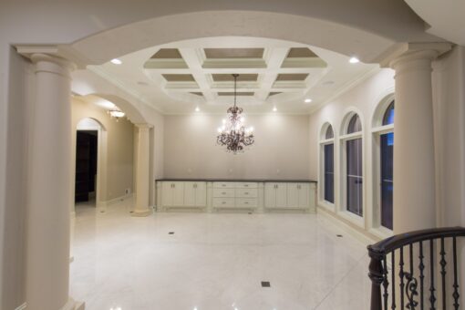 Callista dining room with coffered ceiling and chandelier