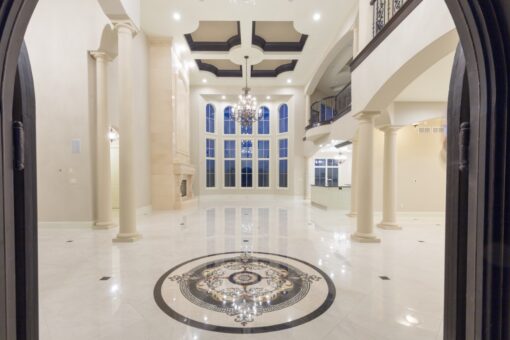 Callista foyer with inlaid marble medallion and columns