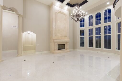 Callista great room with cast stone fireplace and window wall