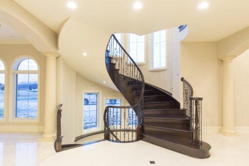 Callista curved staircase with dark wood treads
