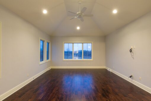 Callista bedroom with hardwood floors and vaulted ceiling