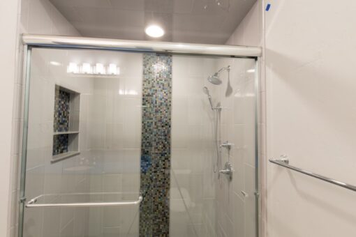 Callista glass shower with mosaic stripe