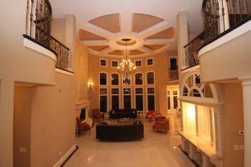 Haven two-story great room with coffered ceiling viewed from the foyer