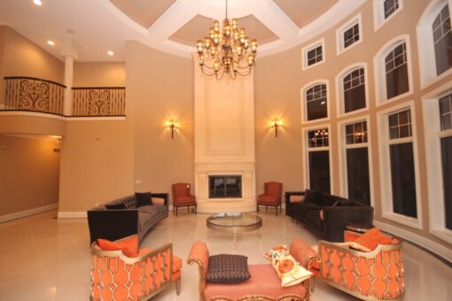Haven great room with two-story fireplace and window wall