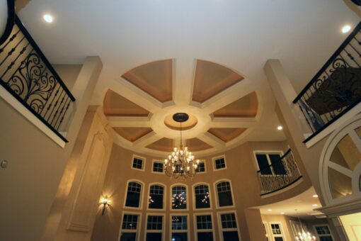 Haven great room ceiling with radiating beams and chandelier