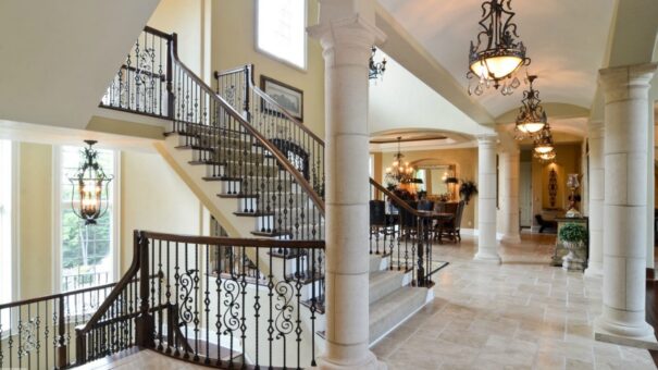 Buckingham foyer staircase with wrought-iron railing and columns