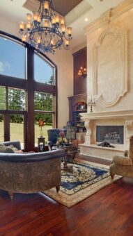 Buckingham great room with carved stone fireplace