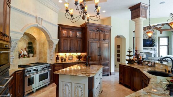 Buckingham kitchen with dark wood cabinetry and granite island