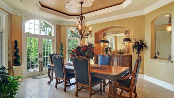 Buckingham dining room with chandelier and arched window