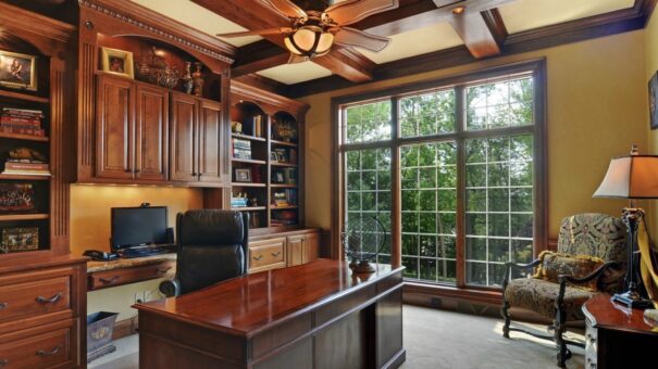 Buckingham home office with wood built-ins and coffered ceiling