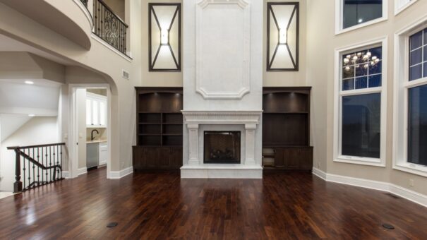 Bella Haven great room fireplace with built-ins and decorative mirrors