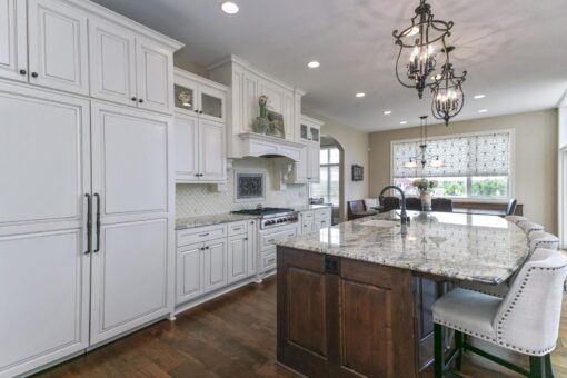 Bradon kitchen with dark island and white cabinetry