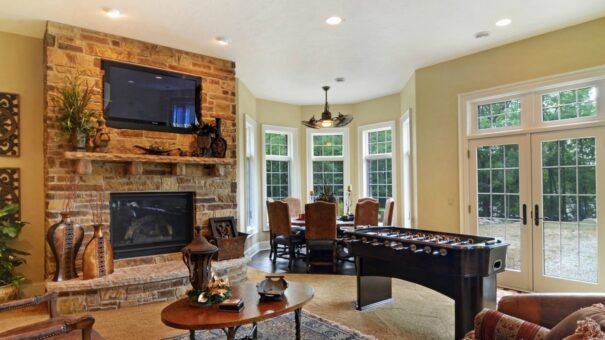 Buckingham lower-level family room with stone fireplace
