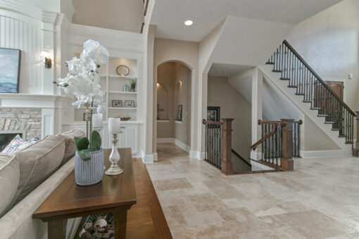 Bradon foyer with arched doorway and staircase